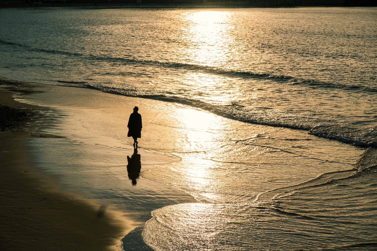 men walking in the beach